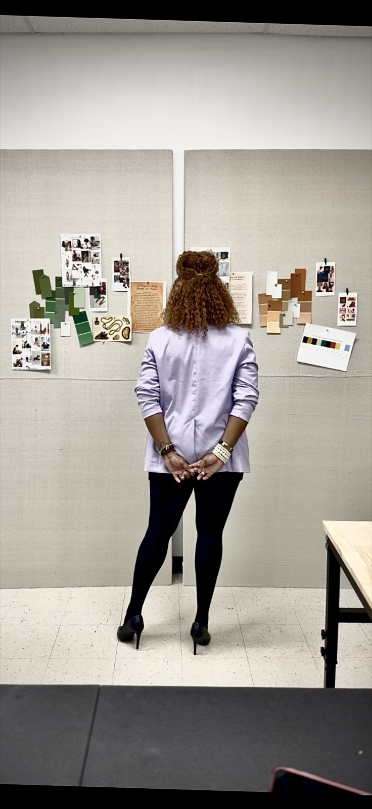 Creative entrepreneur reviewing concepts on a mood board in the Dream Epicenter studio